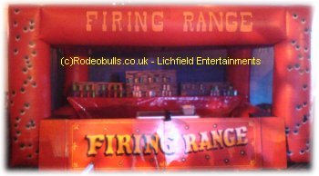 Inflatable Shooting Range. Safe cork firing rifles. How many cans, bottles, etc can you knock down? Bucking Sheep available for hire as an alternative to a Bucking Bronco